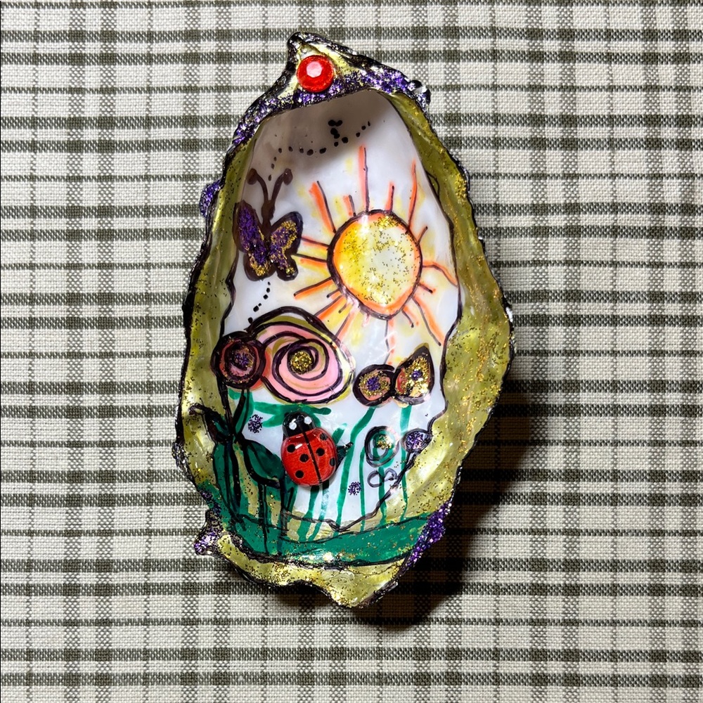 Vibrant Sun and Floral Painted Shell Art